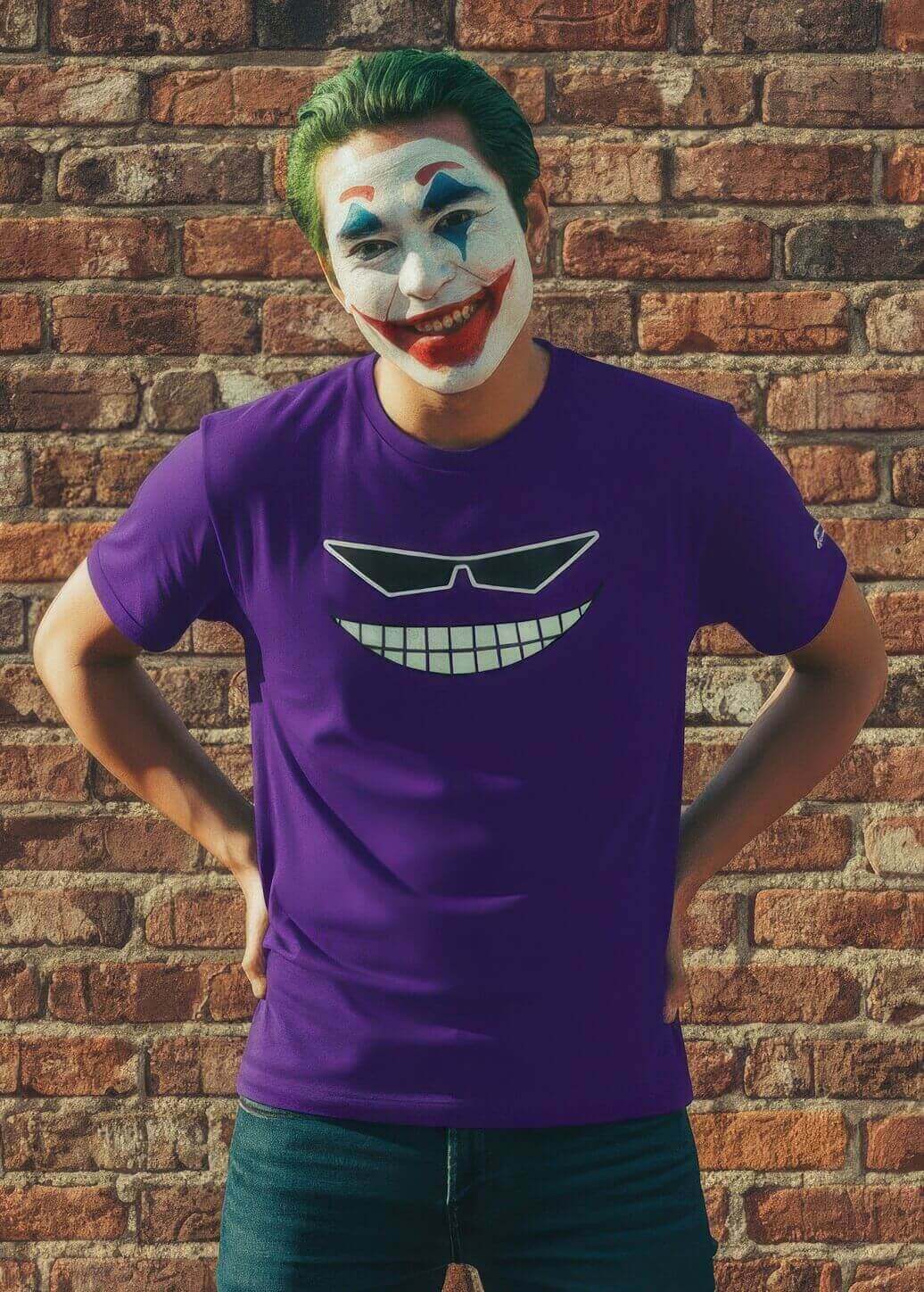 Man with Joker-style makeup and green hair, smiling while wearing the purple Sovereign Emblem "Sovereign Grin" t-shirt.