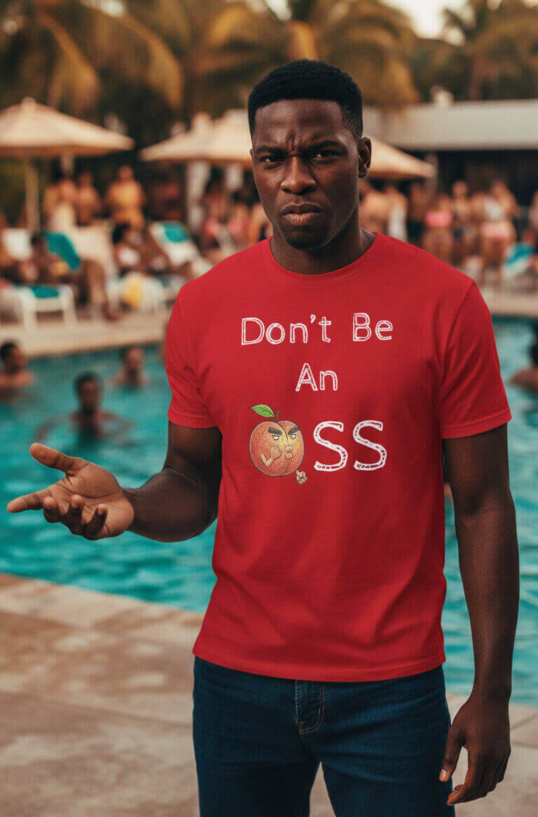 Model with a confident, slightly annoyed expression by the pool, wearing the Sovereign Emblem "Don't Be An 🍑ss" t-shirt in red.