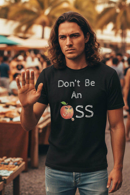 Model with a stern expression and raised hand, wearing the Sovereign Emblem "Don't Be An 🍑ss" t-shirt in black.