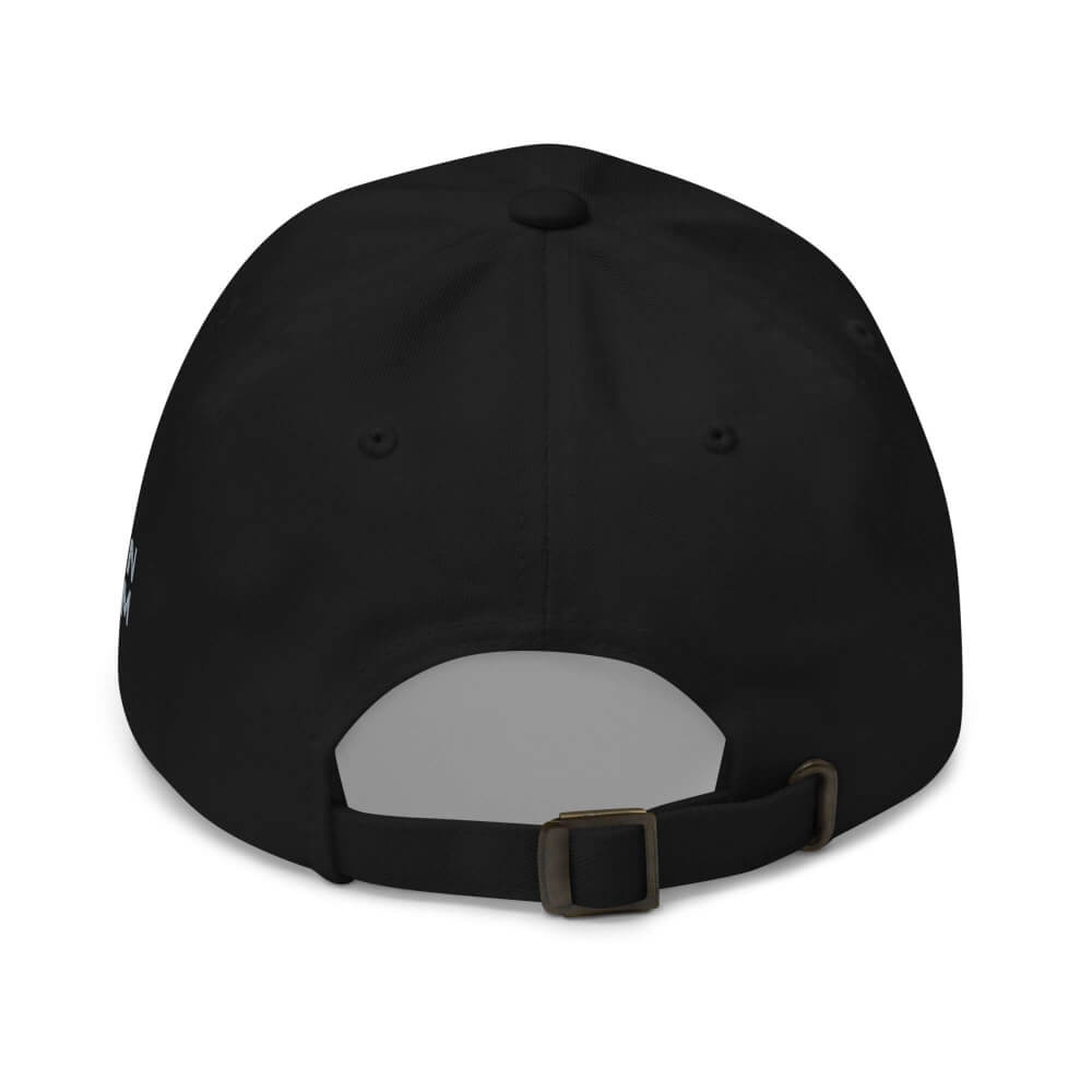 Back view of the black Sovereign Grin dad cap, showing the adjustable fabric strap and antique brass buckle.